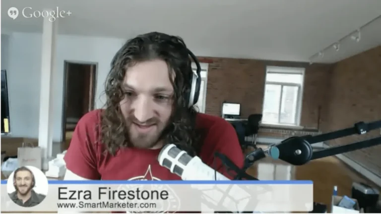 Ezra Firestone wearing a headset while talking on the mic