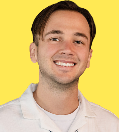 Smiling man in white shirt at marketing conference 2026