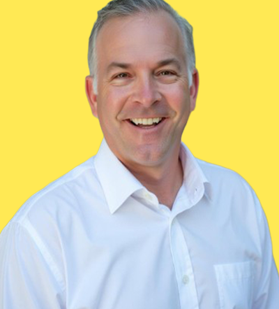 Man in white shirt smiling at Smart Marketer LIVE 2026 marketing conference