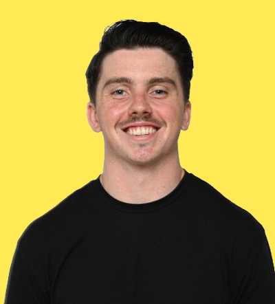 Man smiling with mustache at marketing conference 2026 event