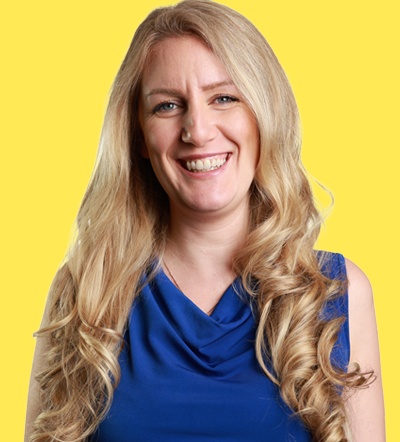 Smiling blonde woman in blue dress at Smart Marketer LIVE 2026 conference