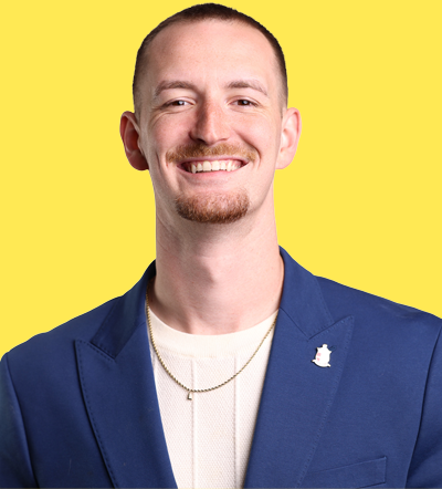 Speaker at marketing conference 2026 on yellow background