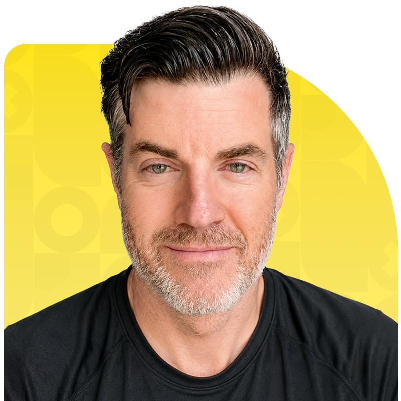 Man with graying hair and beard wearing a black t-shirt